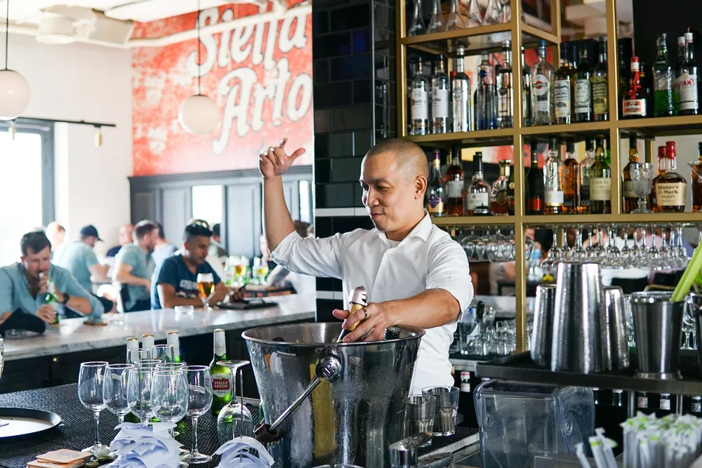 The bar at Motor City under the Stella Artois sign